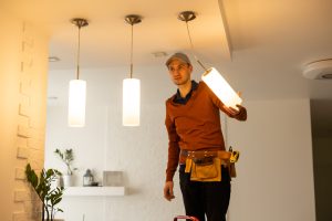 Electrician man working lighting solutions